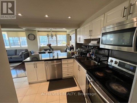 A kitchen with a stove top oven and a microwave.