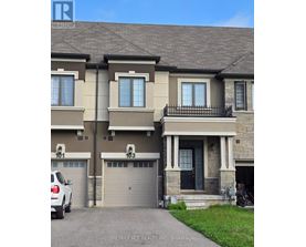 A two-story house with a garage is for sale.