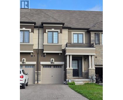 A two-story house with a garage is for sale.