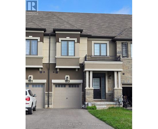 A two-story house with a garage is for sale.