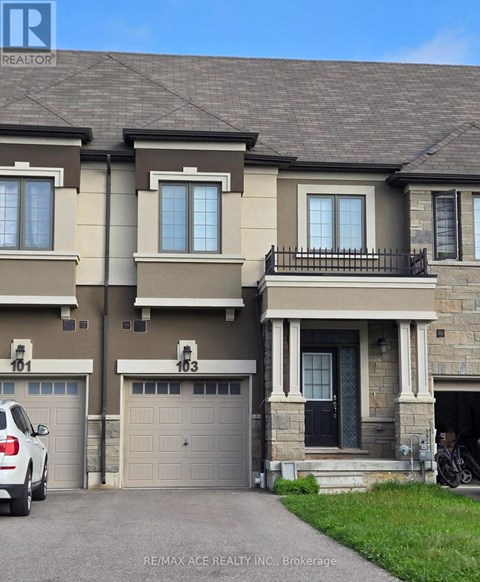 A two-story house with a garage is for sale.
