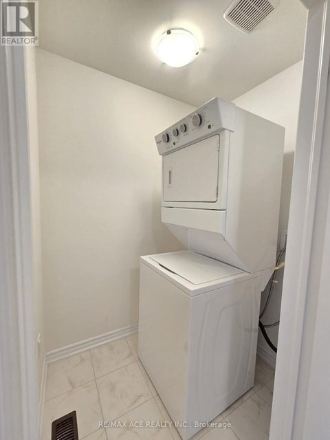 A white oven and dishwasher in a small kitchen.