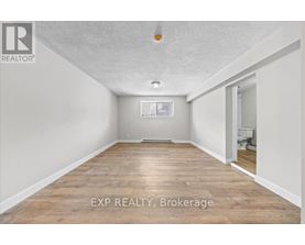 A room with EXP Realty Brokerage written on the floor.
