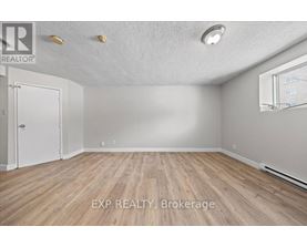 A room with EXP Realty Brokerage logo on the floor.