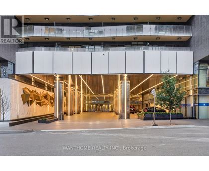The image shows the front of a building with a large glass window and a sign that reads "REALTOR".
