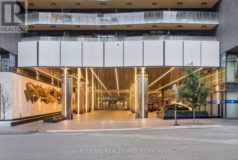 The image shows the front of a building with a large glass window and a sign that reads "REALTOR".