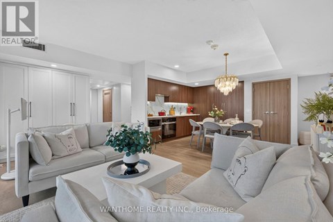 A modern living room with a grey sofa and a coffee table.