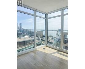 A room with a view of the cityscape and waterfront.