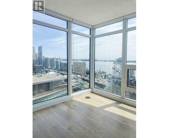 A room with a view of the cityscape and waterfront.