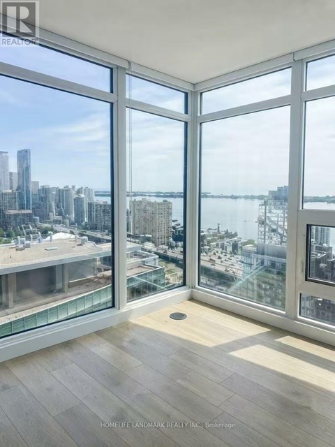 A room with a view of the cityscape and waterfront.