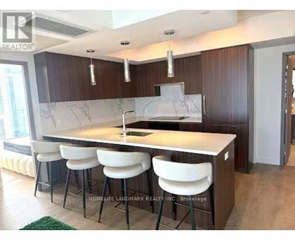 A kitchen with a marble countertop and white bar stools.