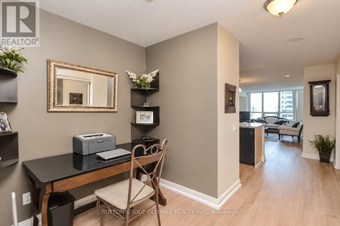 A room with a desk and a chair in it.