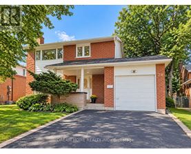 A two-story house with a garage is for sale.