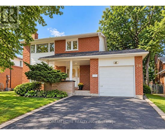 A two-story house with a garage is for sale.