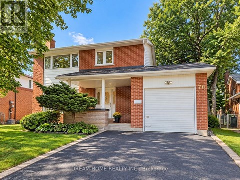 A two-story house with a garage is for sale.