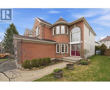 A large house with a red brick exterior and a white garage door.