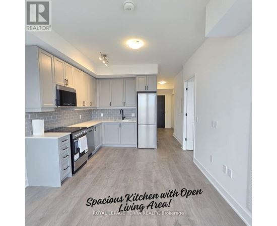 A spacious kitchen with an open living area.