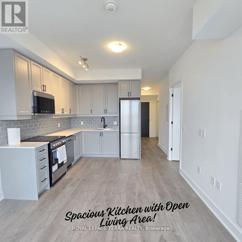 A spacious kitchen with an open living area.