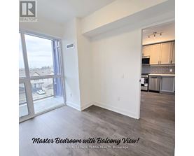 A master bedroom with a balcony view is for sale.