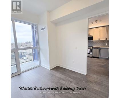 A master bedroom with a balcony view is for sale.