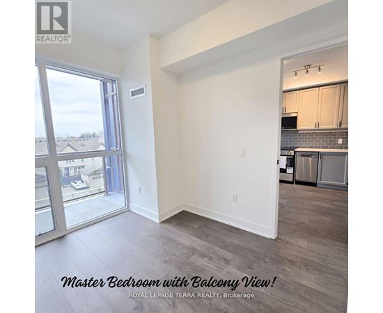 A master bedroom with a balcony view is for sale.
