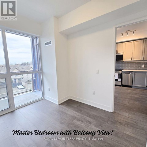 A master bedroom with a balcony view is for sale.