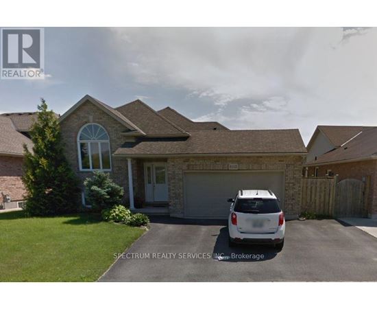 A house with a car parked in front and Spectrum Realty Services Inc. Brokerage written on the image.