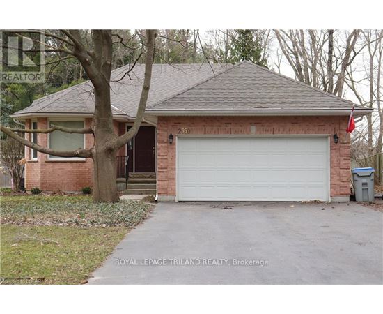 A house with a white garage door is for sale.