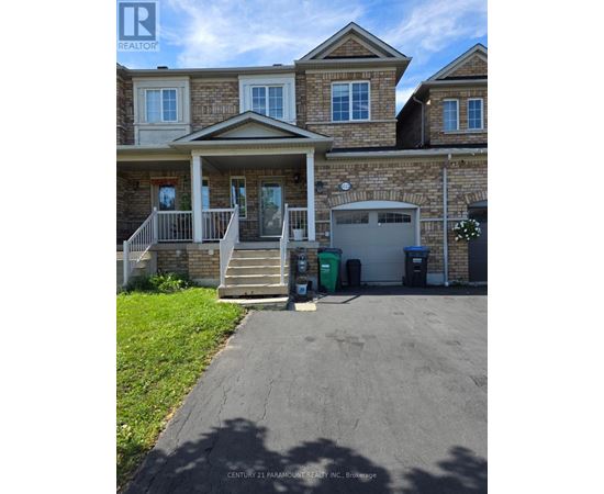 A house with a driveway in front of it.