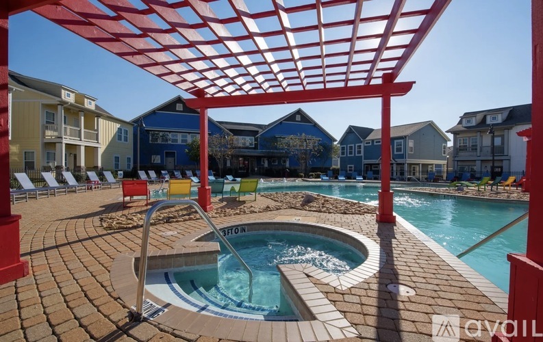 A red pergola shades a small pool.