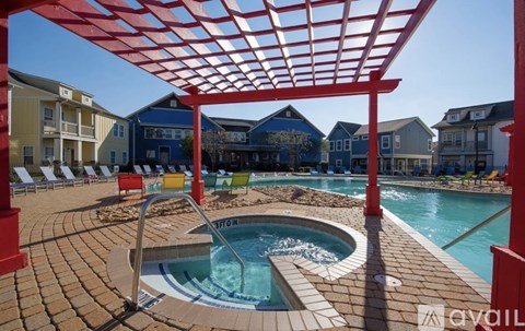 A red pergola shades a small pool.