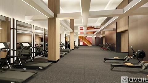 A gym with treadmills, weights, and mirrors.