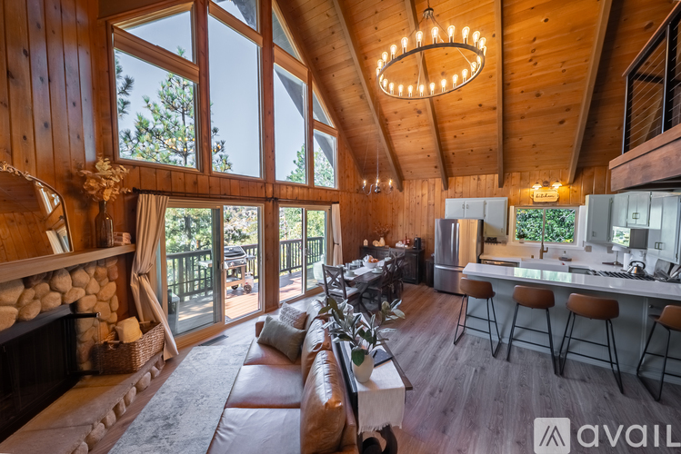 A modern living room with a fireplace and a bar area.