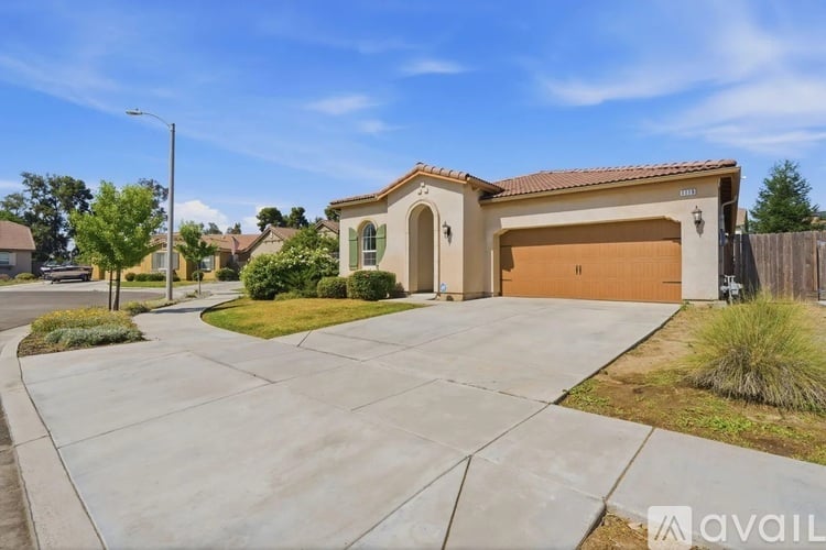 A house with a garage is available for sale.