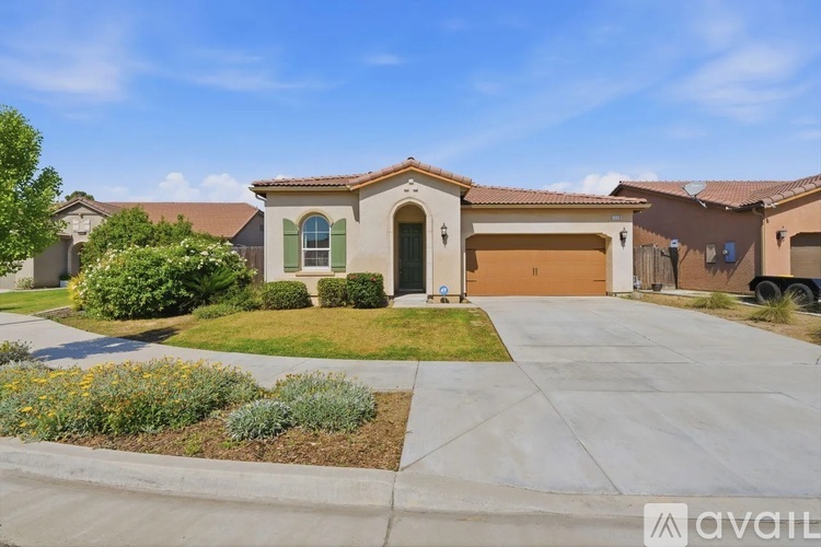 A house with a brown garage door is for sale.