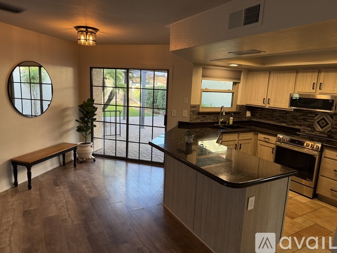 A kitchen with a bench and a window.