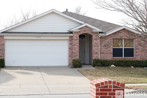 A house with a white garage door and brick exterior.