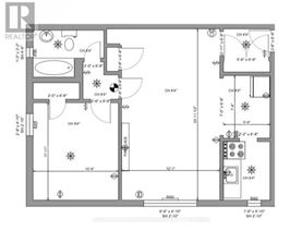 A floor plan of a house with a kitchen, living room, and bathrooms.