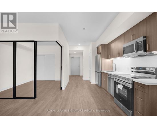 A kitchen with wooden cabinets and a white countertop.