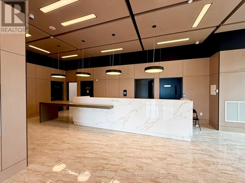A reception area with a marble counter and a sign that says "REALTOR".