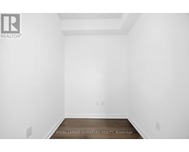 A white room with a Royal LePage logo on the wall.