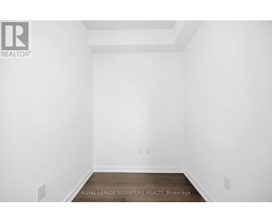A white room with a Royal LePage logo on the wall.