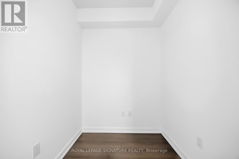 A white room with a Royal LePage logo on the wall.