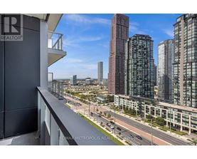 A cityscape with tall buildings and a clear sky.