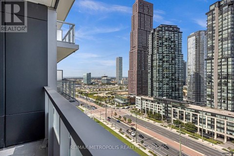 A cityscape with tall buildings and a clear sky.