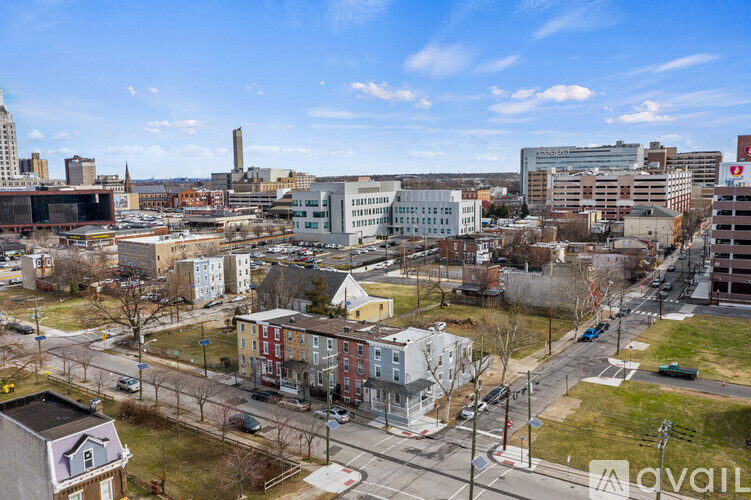 A cityscape with buildings and a clear sky.