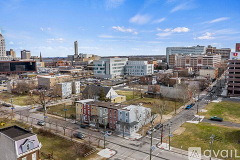 A cityscape with buildings and a clear sky.