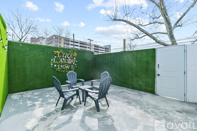 A patio with a table and chairs is set up outside.