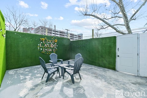A patio with a table and chairs is set up outside.