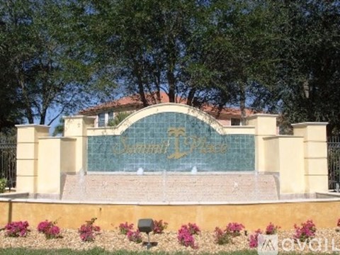 A building with a sign that says "Sunset Place" in front of it.